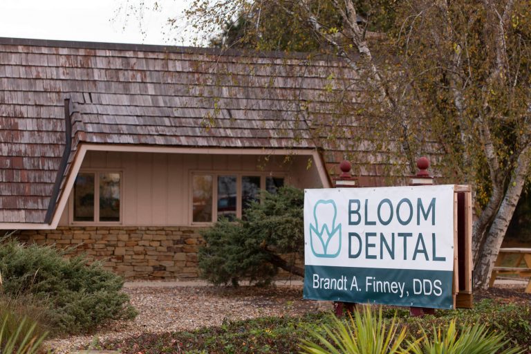 outside building and front building sign of bloom dental, a dentist office in bloomington indiana