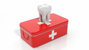 illustration of a tooth on a red first aid kid 