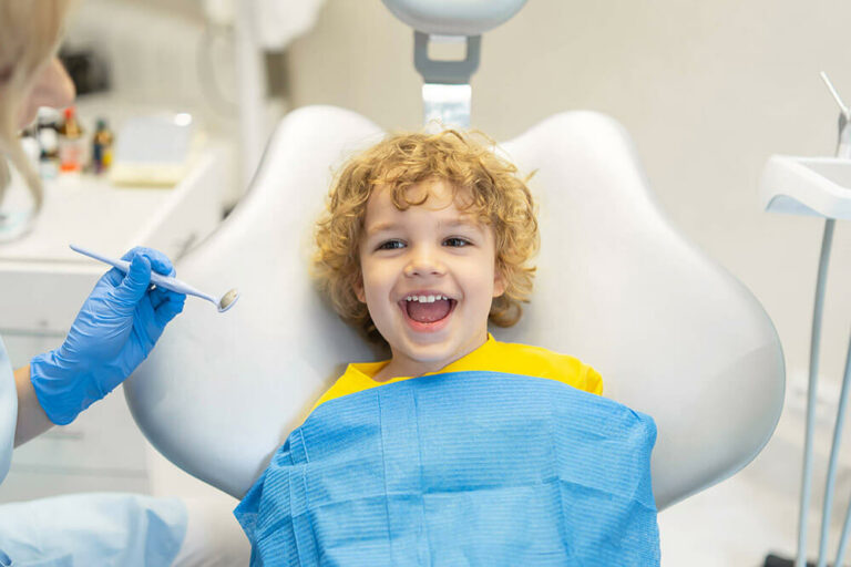 smiling child receiving dental care